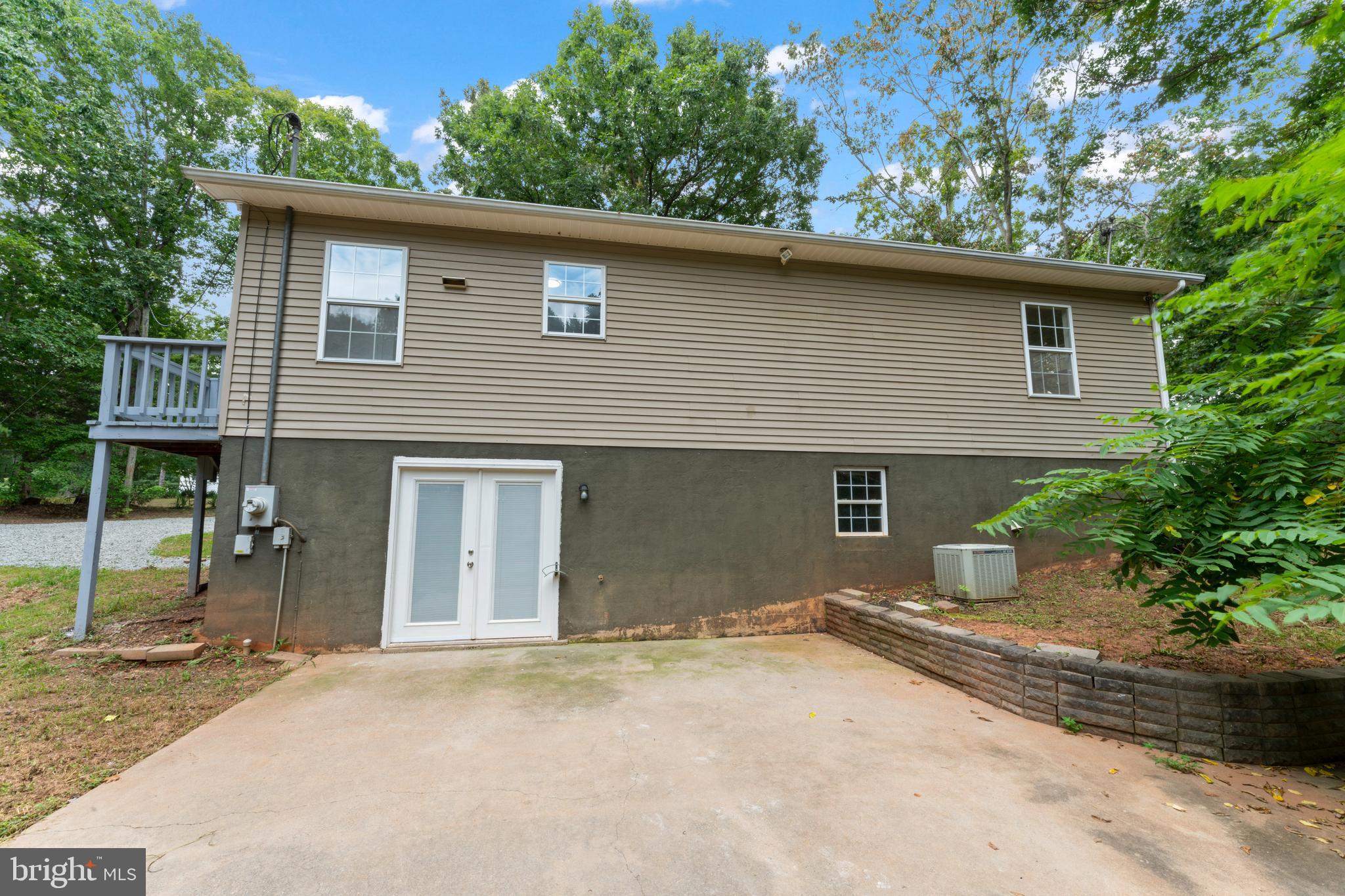 1543 Vawter Corner Road Louisa, VA 23093 - Photo 14 of 43 a front view of a house with a yard and garage