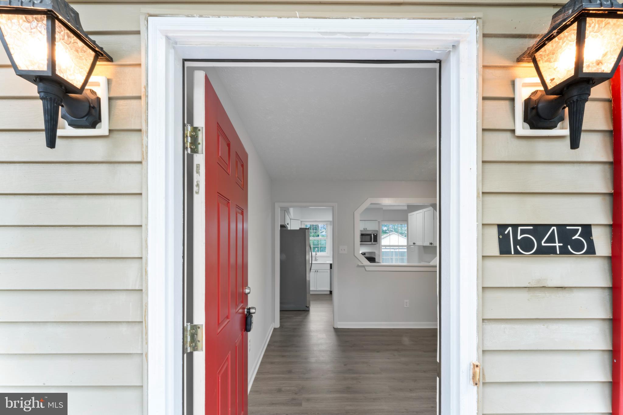 1543 Vawter Corner Road Louisa, VA 23093 - Photo 16 of 43 a view of a hallway with wooden floor and windows