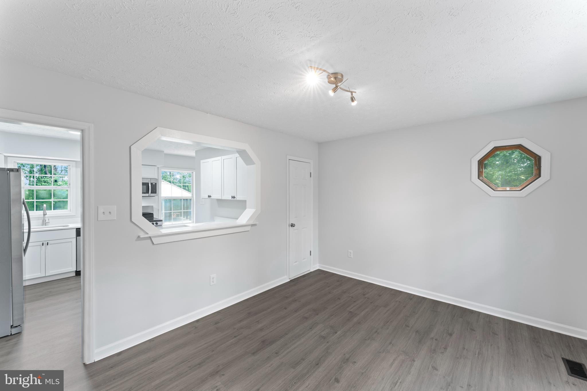 1543 Vawter Corner Road Louisa, VA 23093 - Photo 19 of 43 an empty room with wooden floor and windows