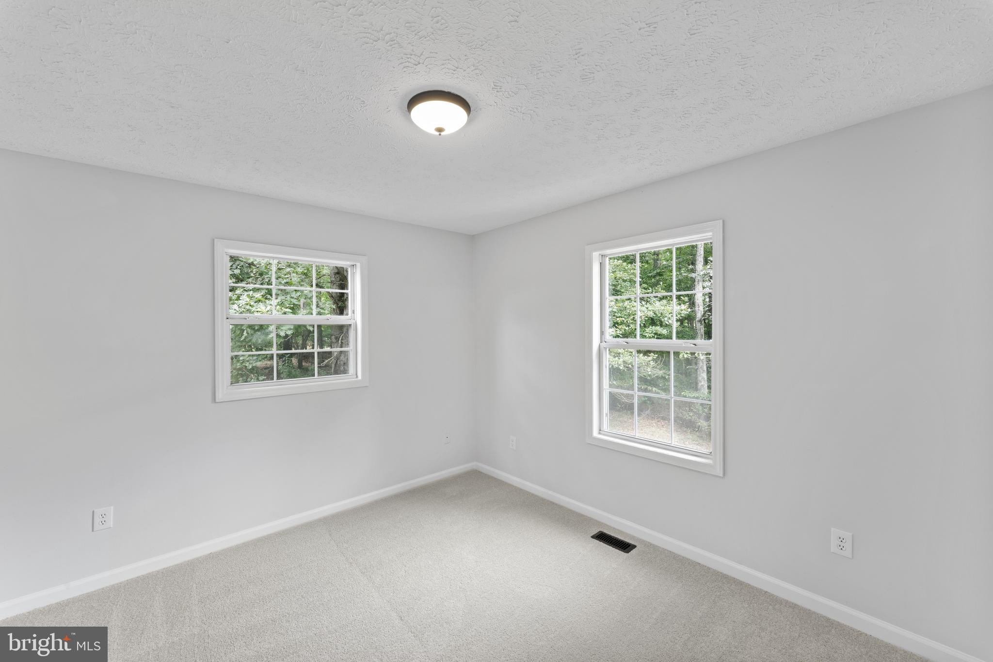 1543 Vawter Corner Road Louisa, VA 23093 - Photo 33 of 43 an empty room with a window