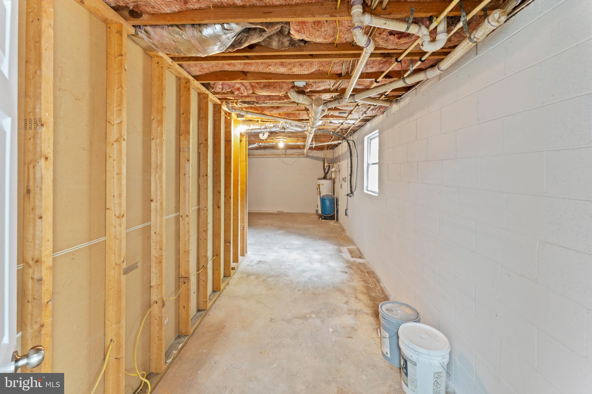 1543 Vawter Corner Road Louisa, VA 23093 - Photo 41 of 43 a view of a hallway with wooden walls and stairs