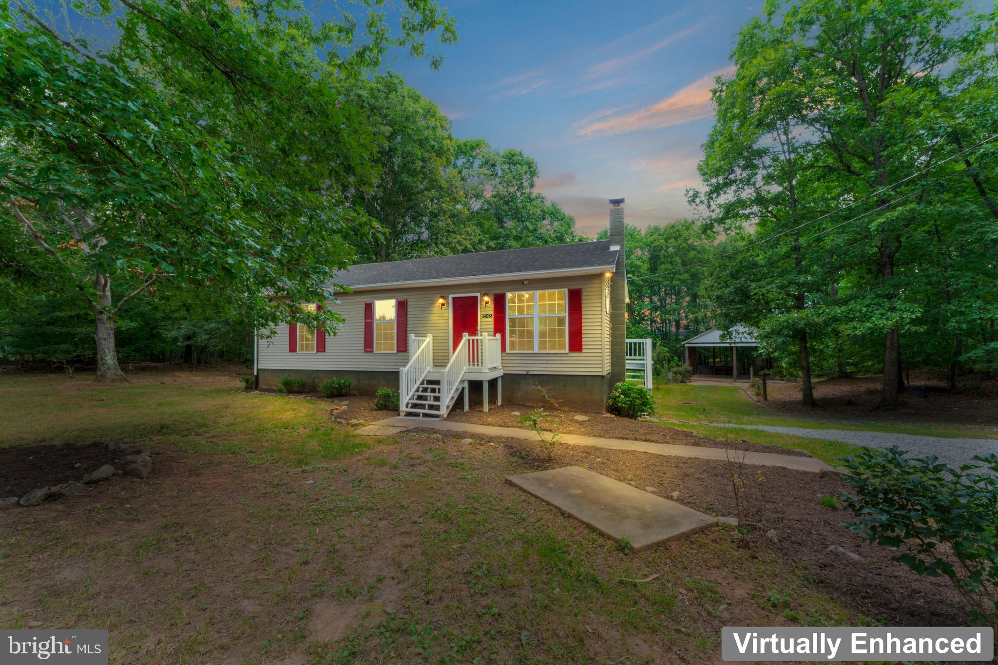 1543 Vawter Corner Road Louisa, VA 23093 - Photo 6 of 43 a view of a house with a yard