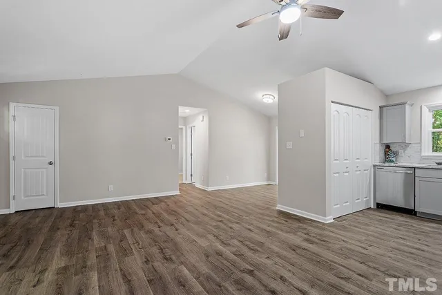 a view of a kitchen with a sink and a stove top oven