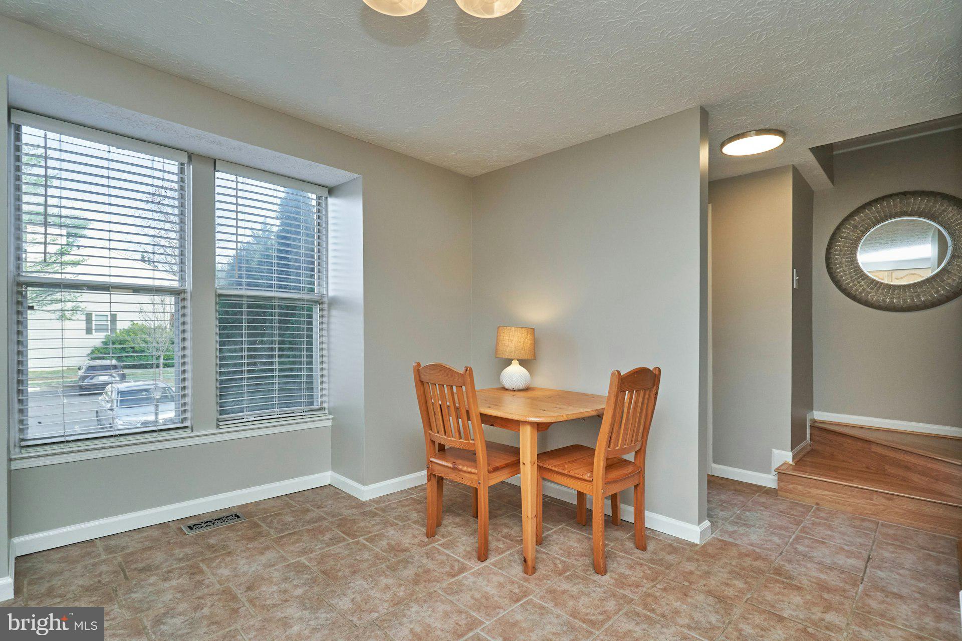1750 Sundance Drive Reston, VA 20194 - Photo 14 of 36 a dining room with furniture and a window
