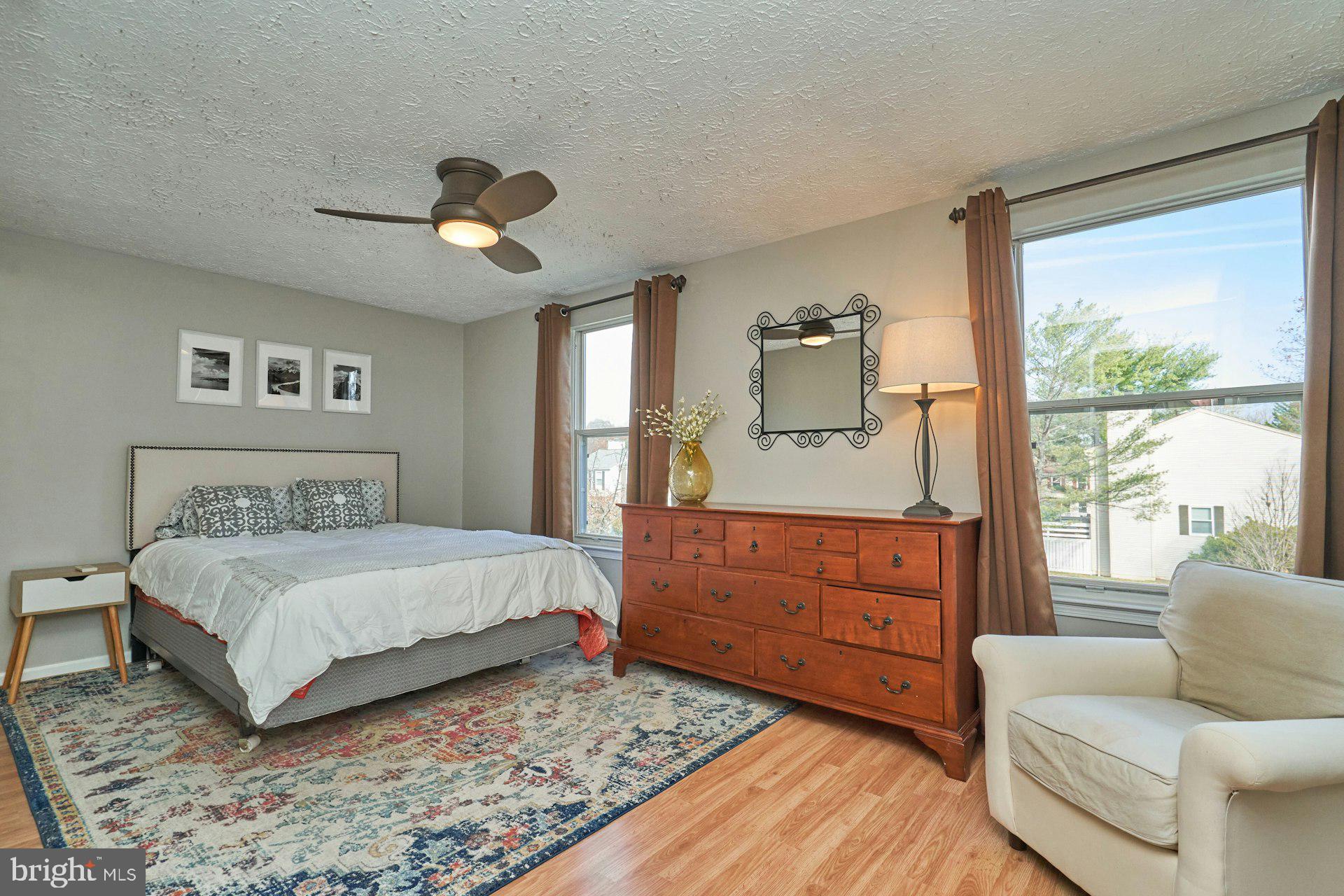 1750 Sundance Drive Reston, VA 20194 - Photo 16 of 36 a bedroom with a large bed and windows