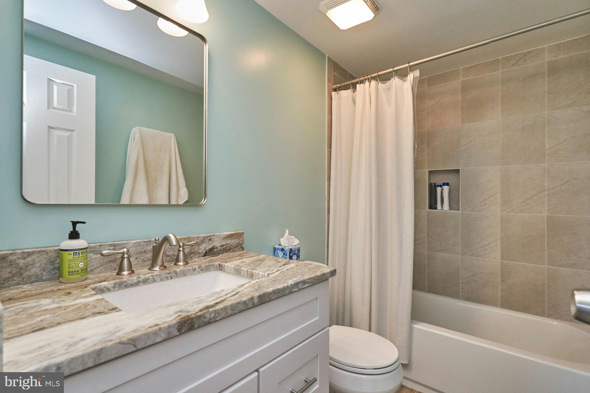 1750 Sundance Drive Reston, VA 20194 - Photo 19 of 36 a bathroom with a granite countertop sink toilet and shower