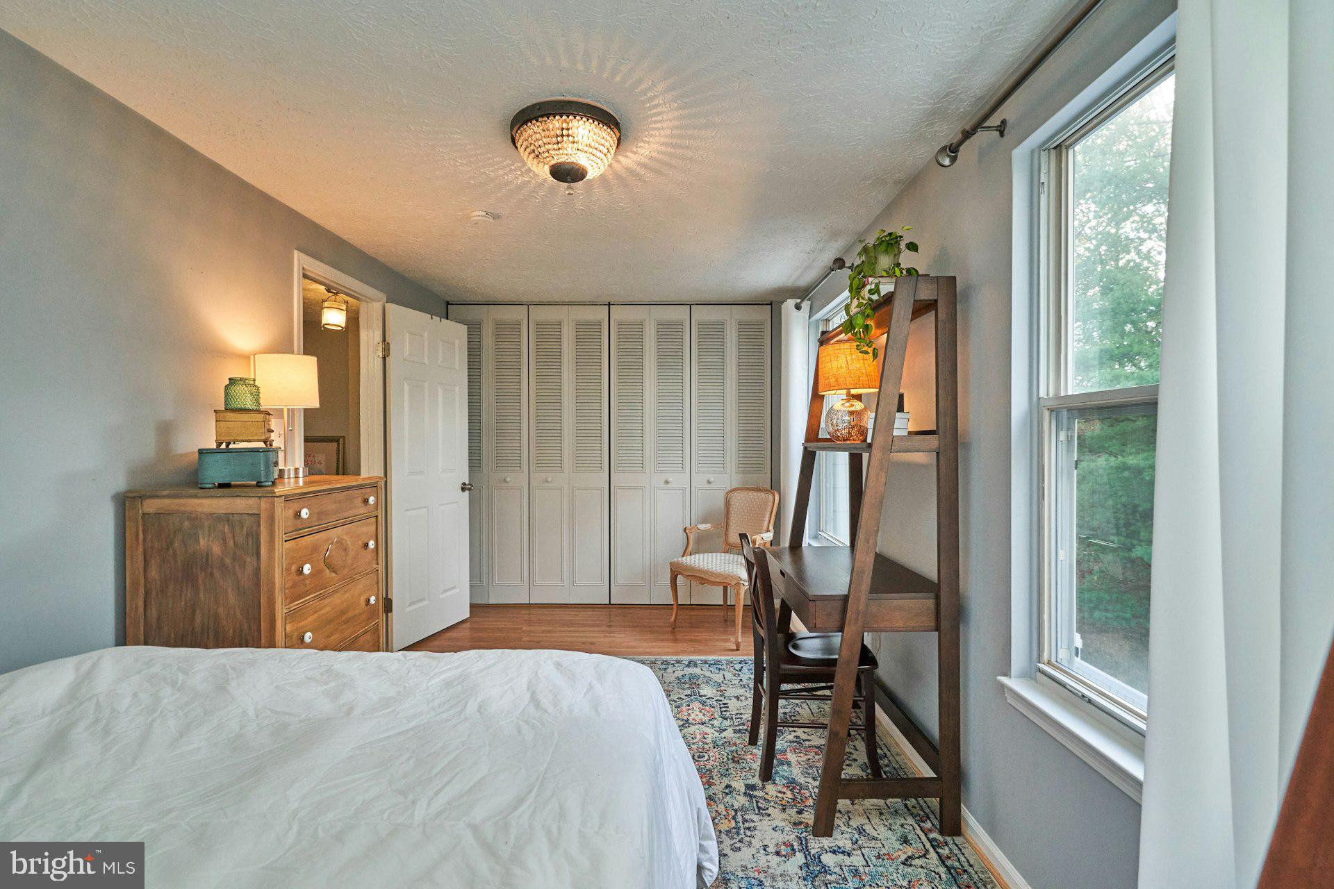 1750 Sundance Drive Reston, VA 20194 - Photo 22 of 36 a bedroom with a bed and wooden floor