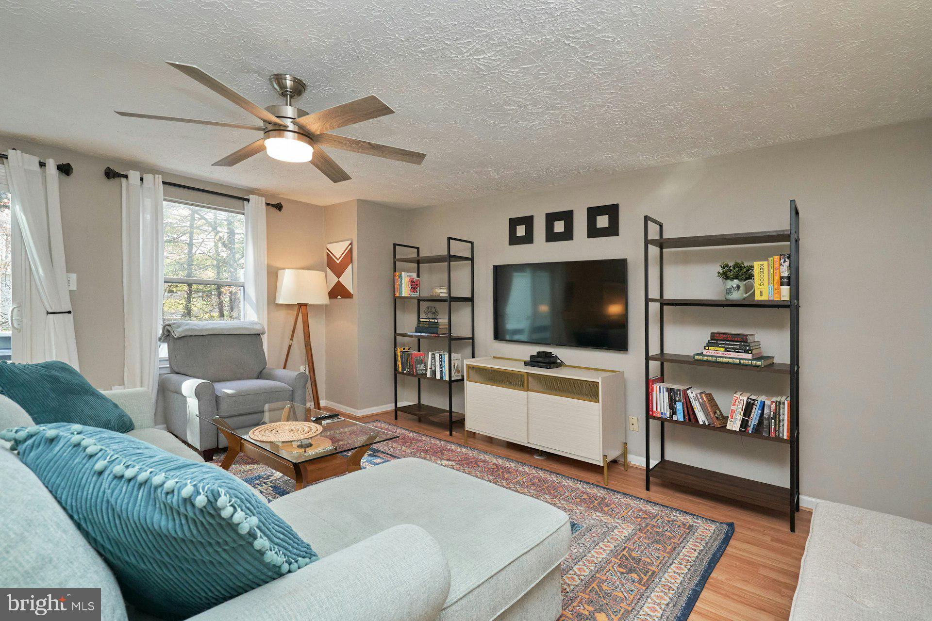 1750 Sundance Drive Reston, VA 20194 - Photo 7 of 36 a living room with furniture and a flat screen tv