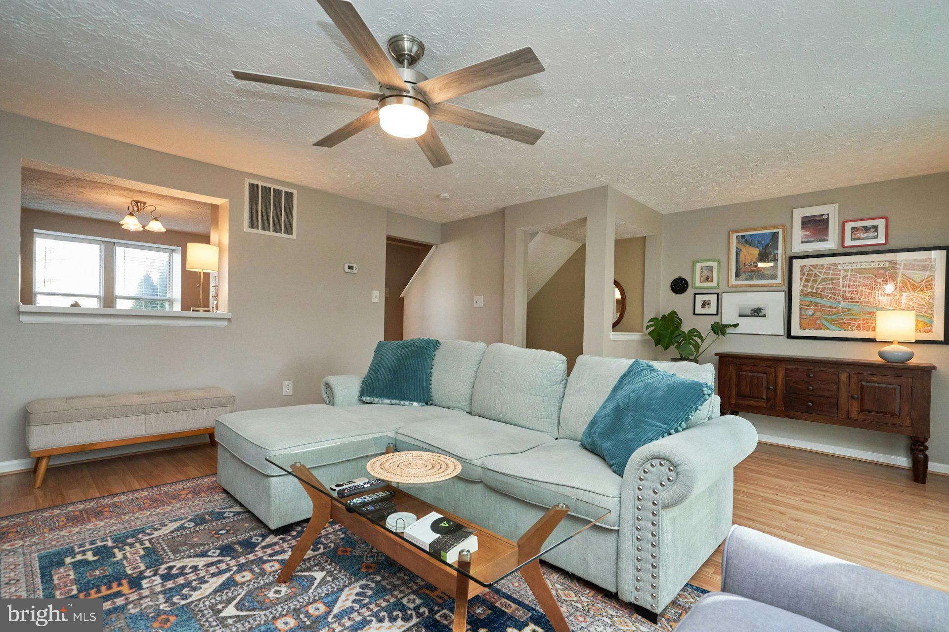 1750 Sundance Drive Reston, VA 20194 - Photo 9 of 36 a living room with furniture and a flat screen tv