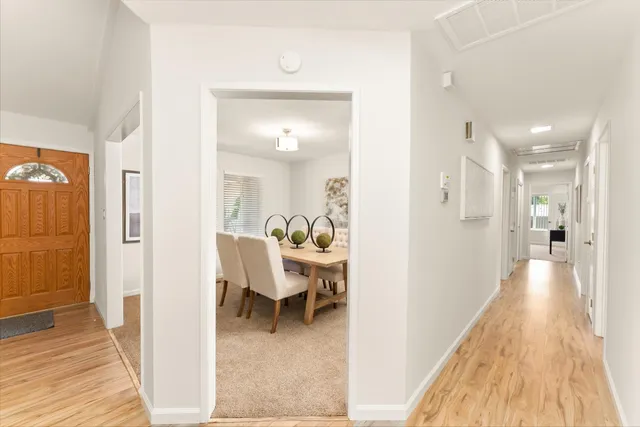 a view of a living room with a wooden floor