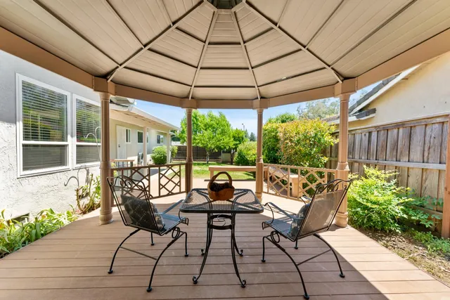 a view of outdoor space with deck and yard