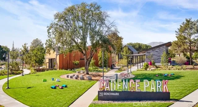 a front view of a house with a yard table and chairs