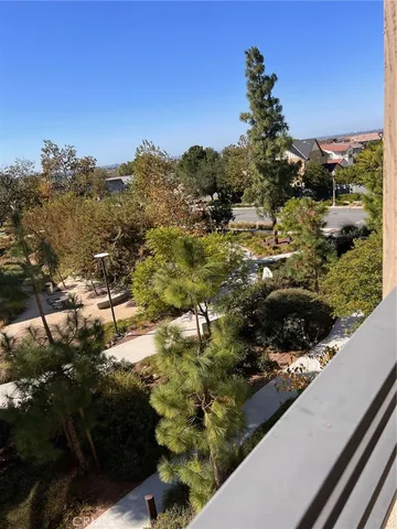 a view of a garden with an ocean view