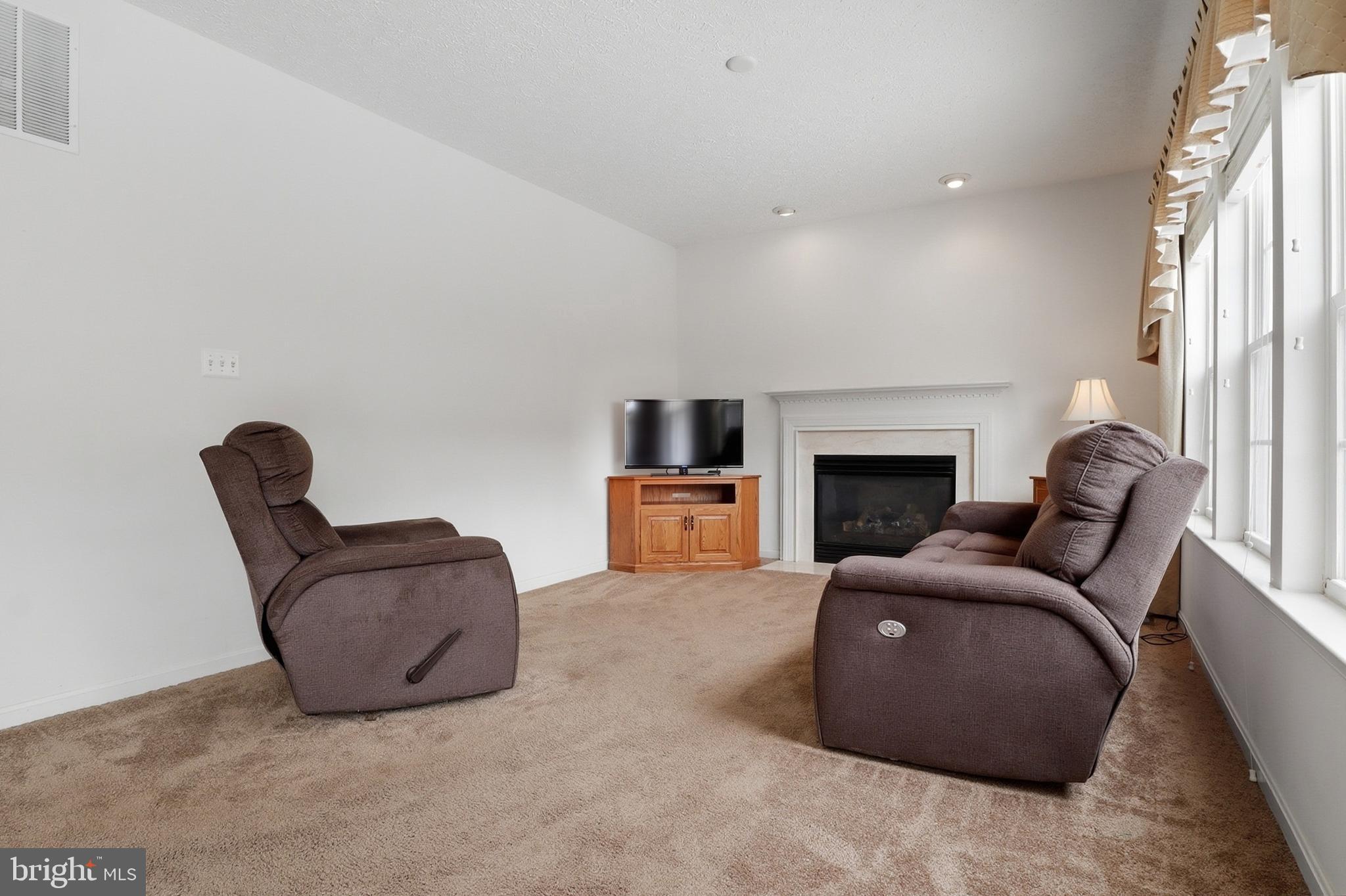 233 Sunset Circle Red Lion, PA 17356 - Photo 11 of 54 a living room with furniture and a fireplace