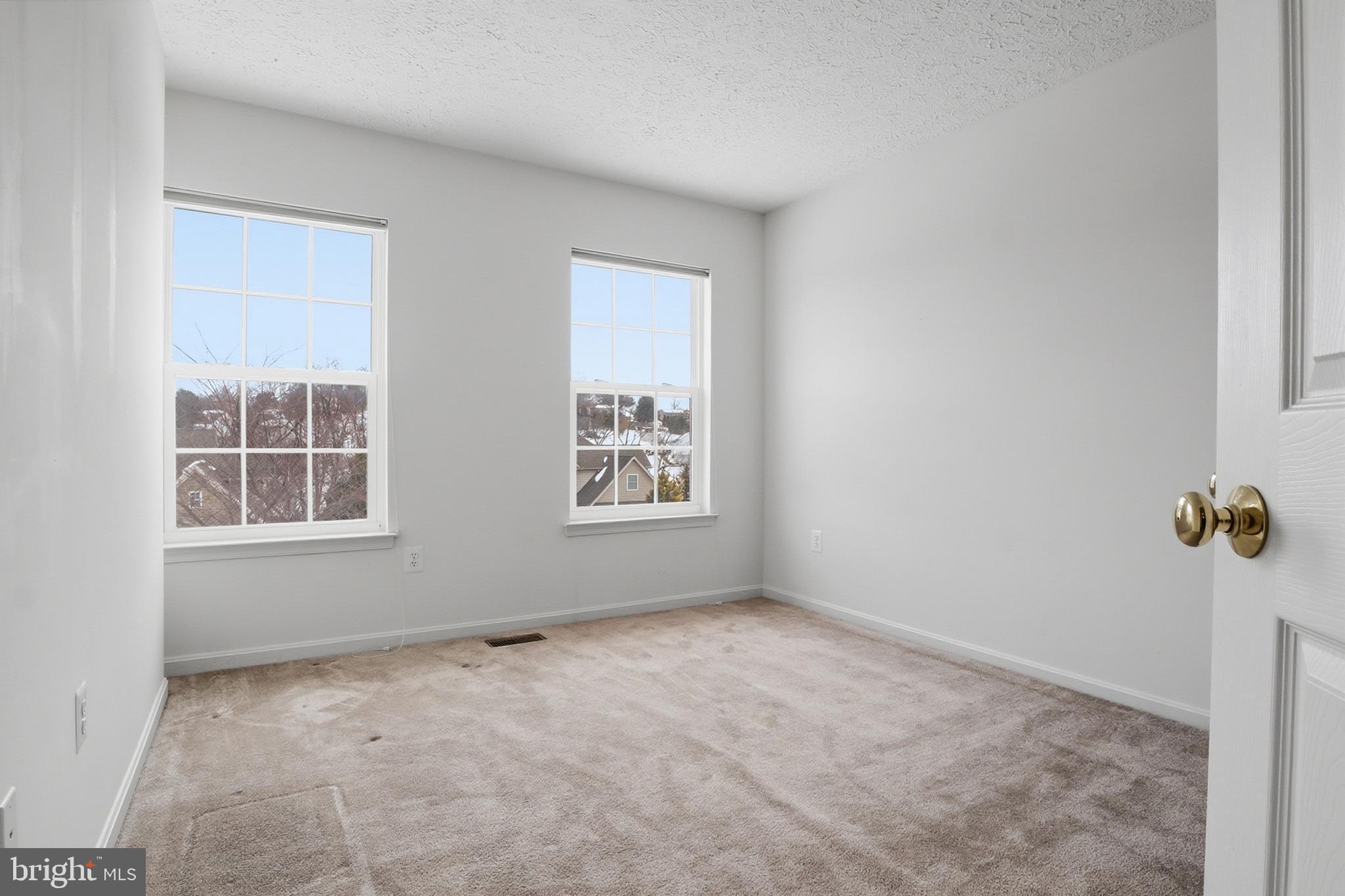 233 Sunset Circle Red Lion, PA 17356 - Photo 17 of 54 an empty room with windows
