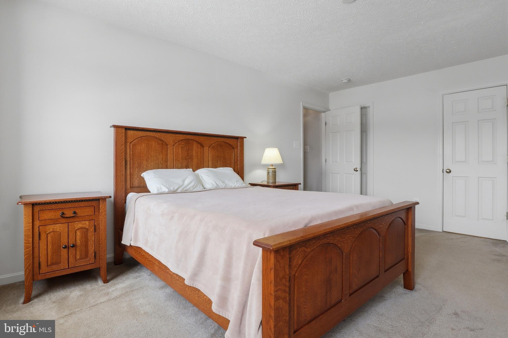 233 Sunset Circle Red Lion, PA 17356 - Photo 23 of 54 a bedroom with a bed and a dresser