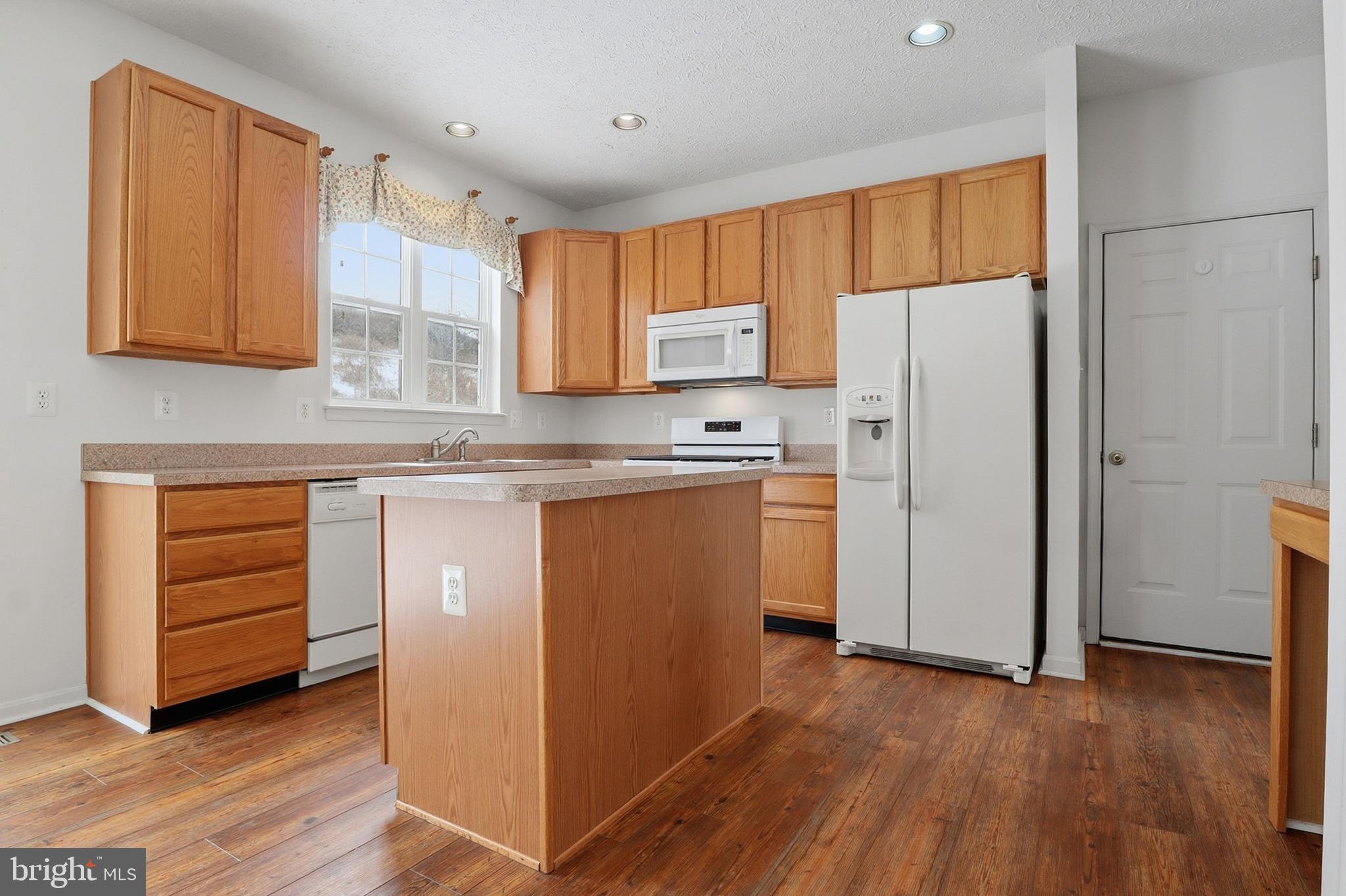 233 Sunset Circle Red Lion, PA 17356 - Photo 6 of 54 a kitchen with a refrigerator sink and cabinets