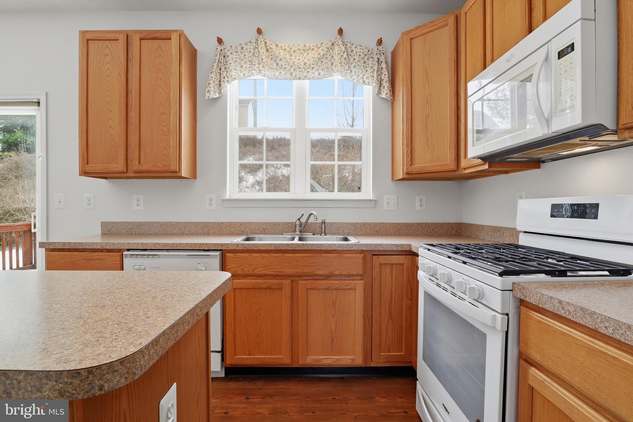 233 Sunset Circle Red Lion, PA 17356 - Photo 7 of 54 a kitchen with stainless steel appliances granite countertop a sink stove and cabinets