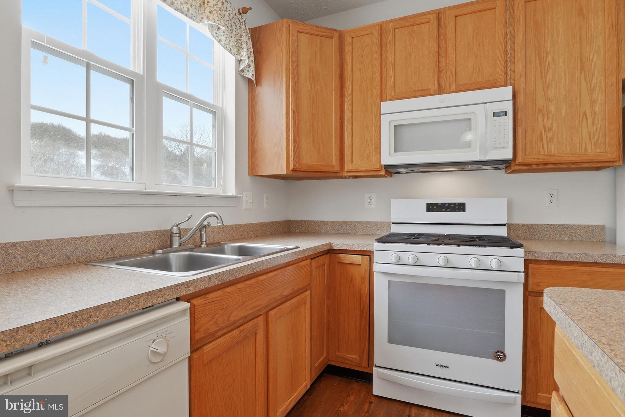 233 Sunset Circle Red Lion, PA 17356 - Photo 8 of 54 a kitchen with appliances a sink and a microwave