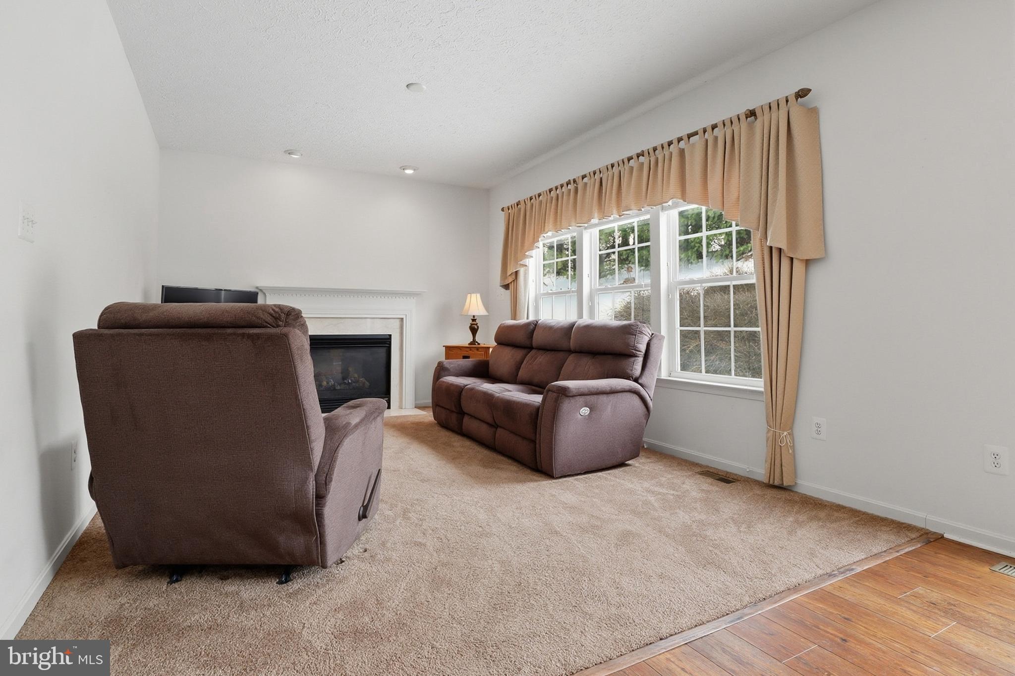 233 Sunset Circle Red Lion, PA 17356 - Photo 10 of 54 a living room with furniture and a fireplace