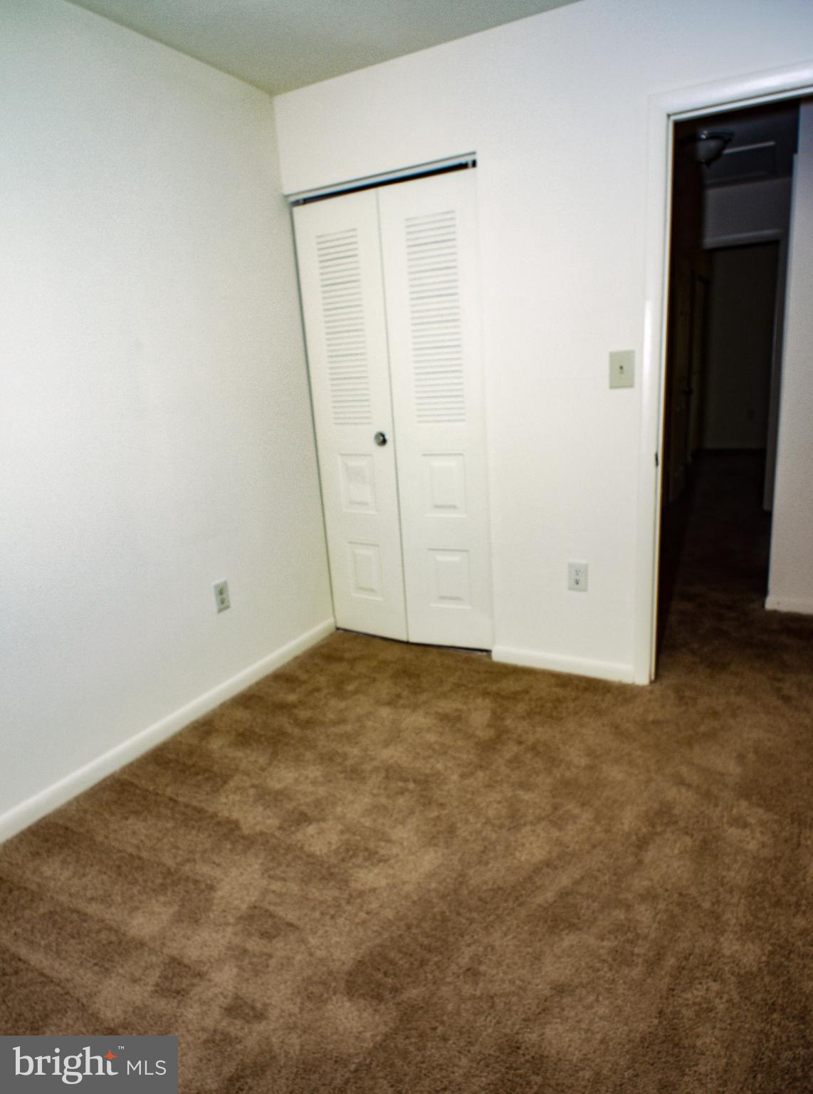 6661 Spring Mill Circle Baltimore, MD 21207 - Photo 12 of 22 an empty room with closet