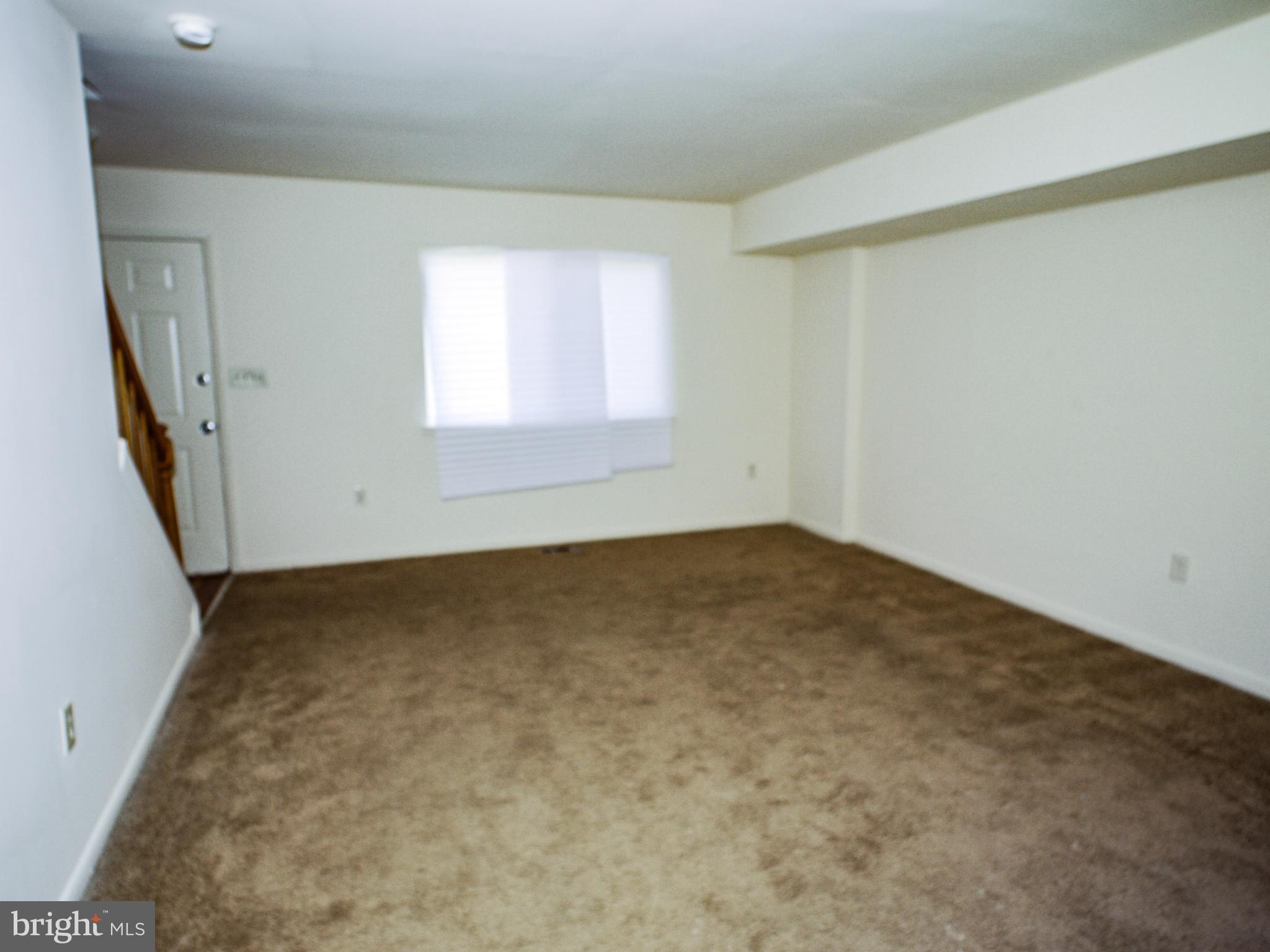 6661 Spring Mill Circle Baltimore, MD 21207 - Photo 3 of 22 an empty room with a window
