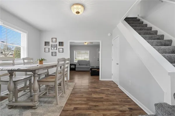 a dining room with furniture and window