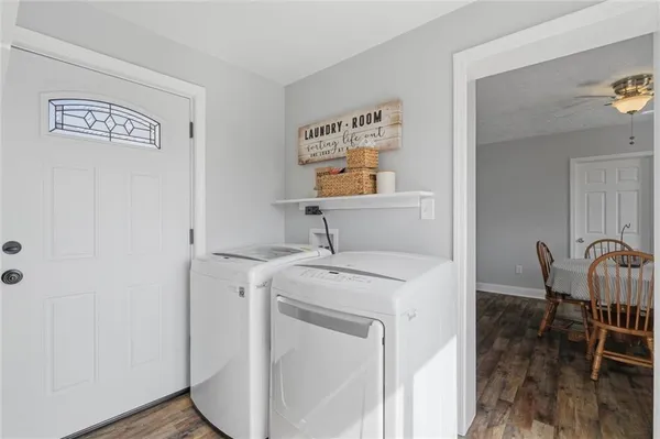 a utility room with dryer and washer