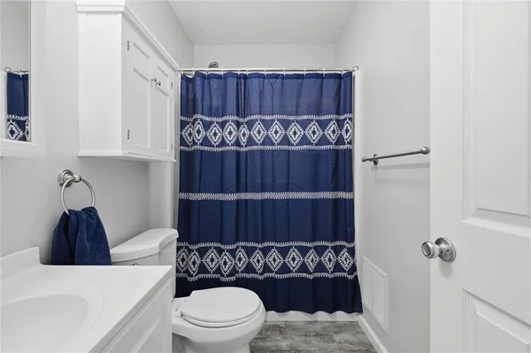 a bathroom with a bathtub and shower
