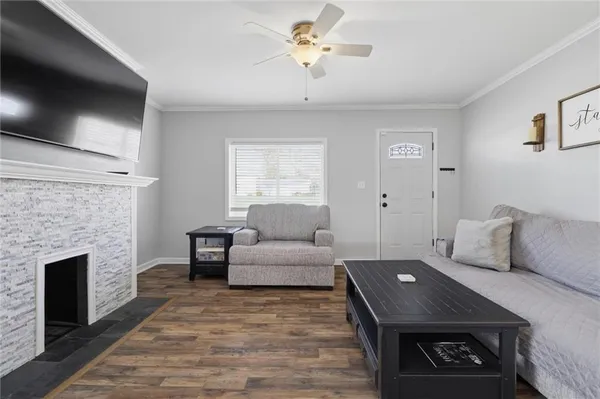 a living room with furniture and a fireplace