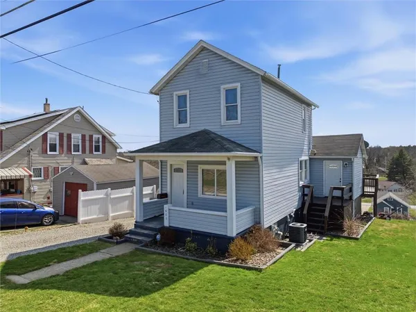 a front view of a house with a yard