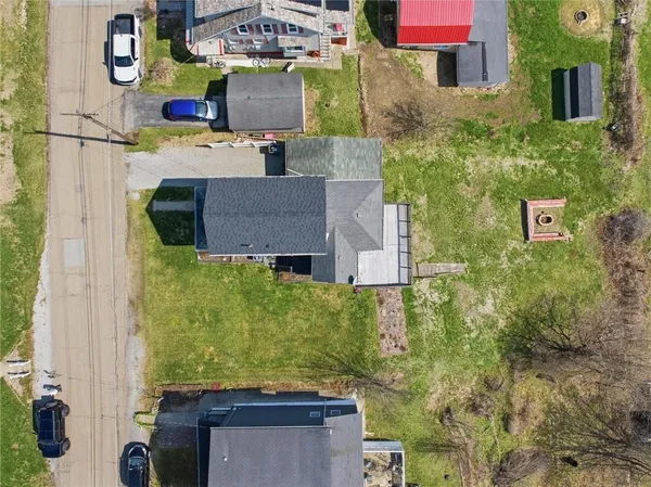 aerial view of a house with a yard
