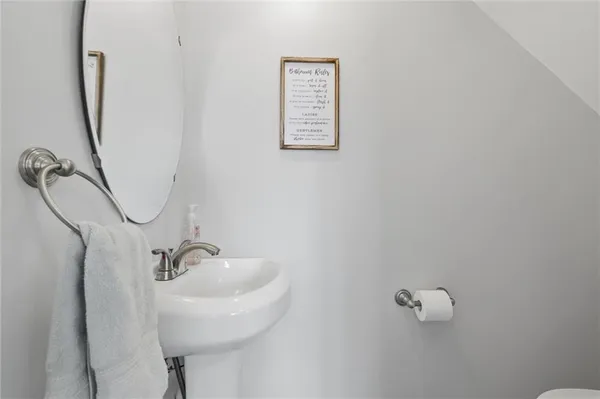 a bathroom with a sink and mirror
