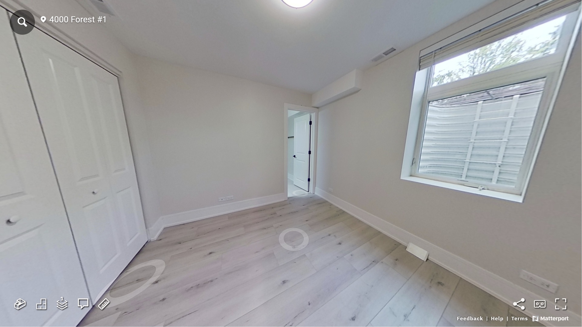 4000 Forest Avenue, Unit 1 Brookfield, IL 60513 - Photo 8 of 10 a view of an empty room with wooden floor and a window