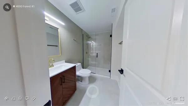 a bathroom with a toilet sink and a mirror