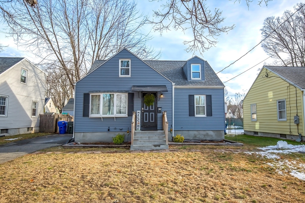 65 Garland Street Springfield, MA 01118 - Photo 2 of 39 a front view of a house with a yard