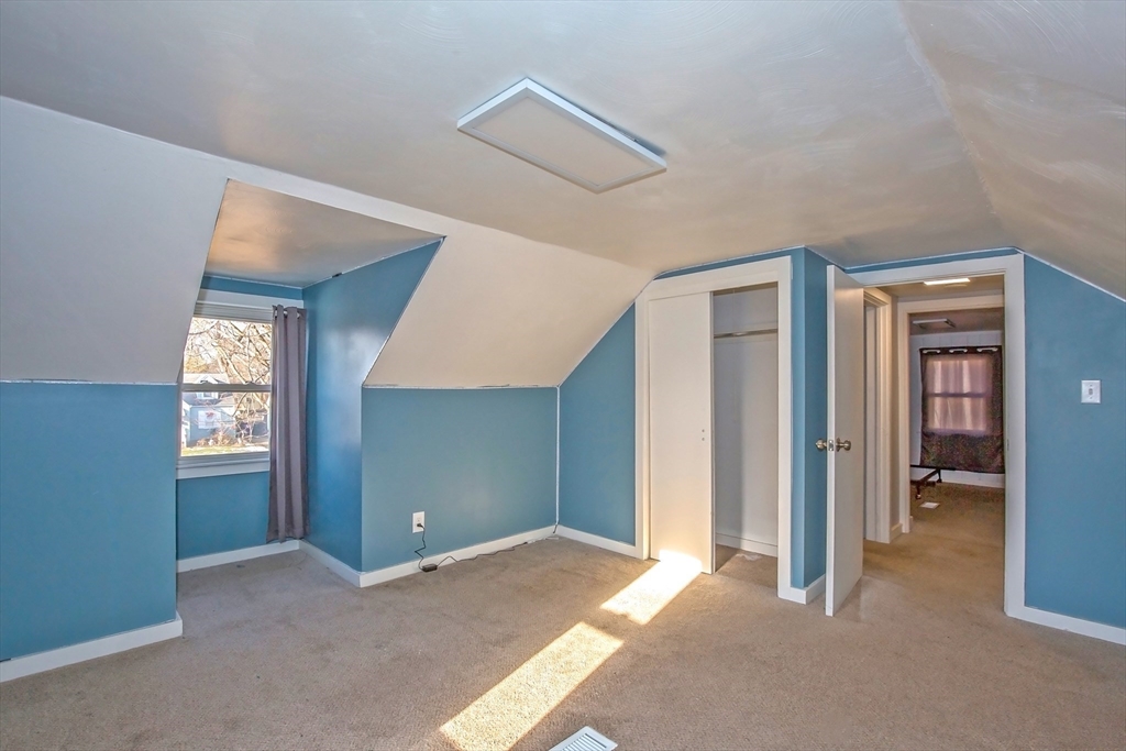 65 Garland Street Springfield, MA 01118 - Photo 27 of 39 a view of a room with windows and closet