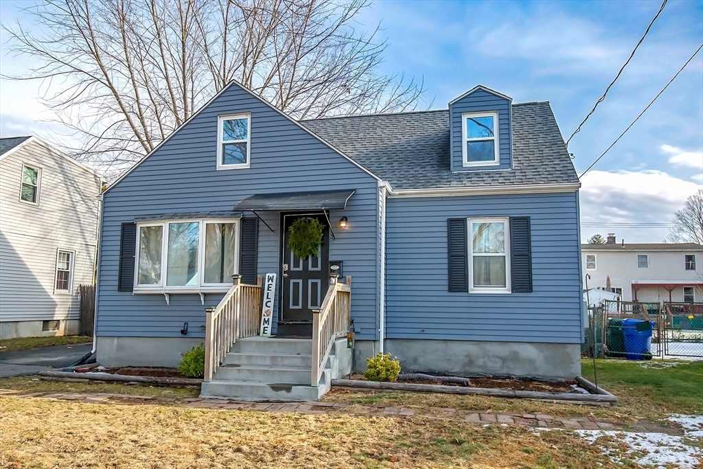 65 Garland Street Springfield, MA 01118 - Photo 3 of 39 a front view of a house with garden
