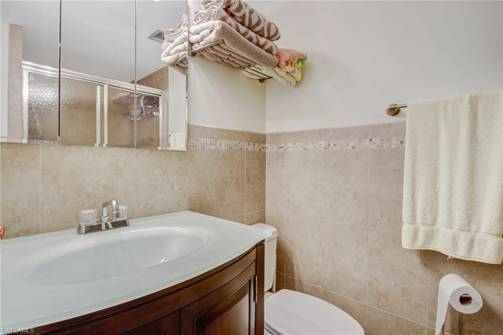 49 High Point Circle South, Unit 102 Naples, FL 34103 - Photo 17 of 42 Master bathroom