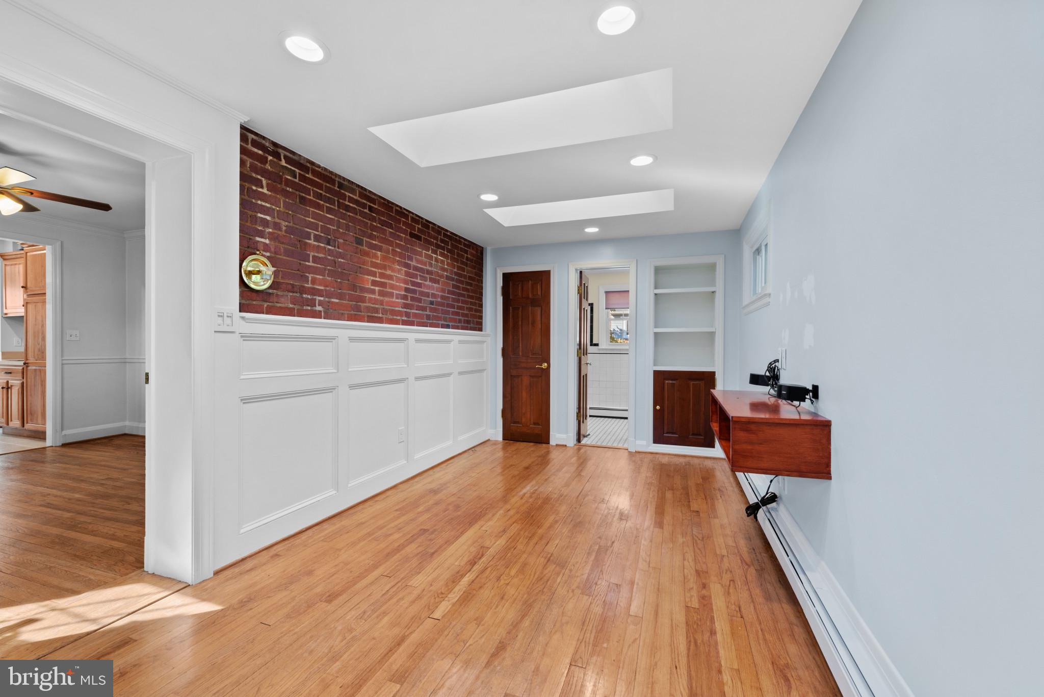 17 Cedarwood Road Baltimore, MD 21228 - Photo 7 of 40 Enjoy hardwood floors, exposed brick and skylights