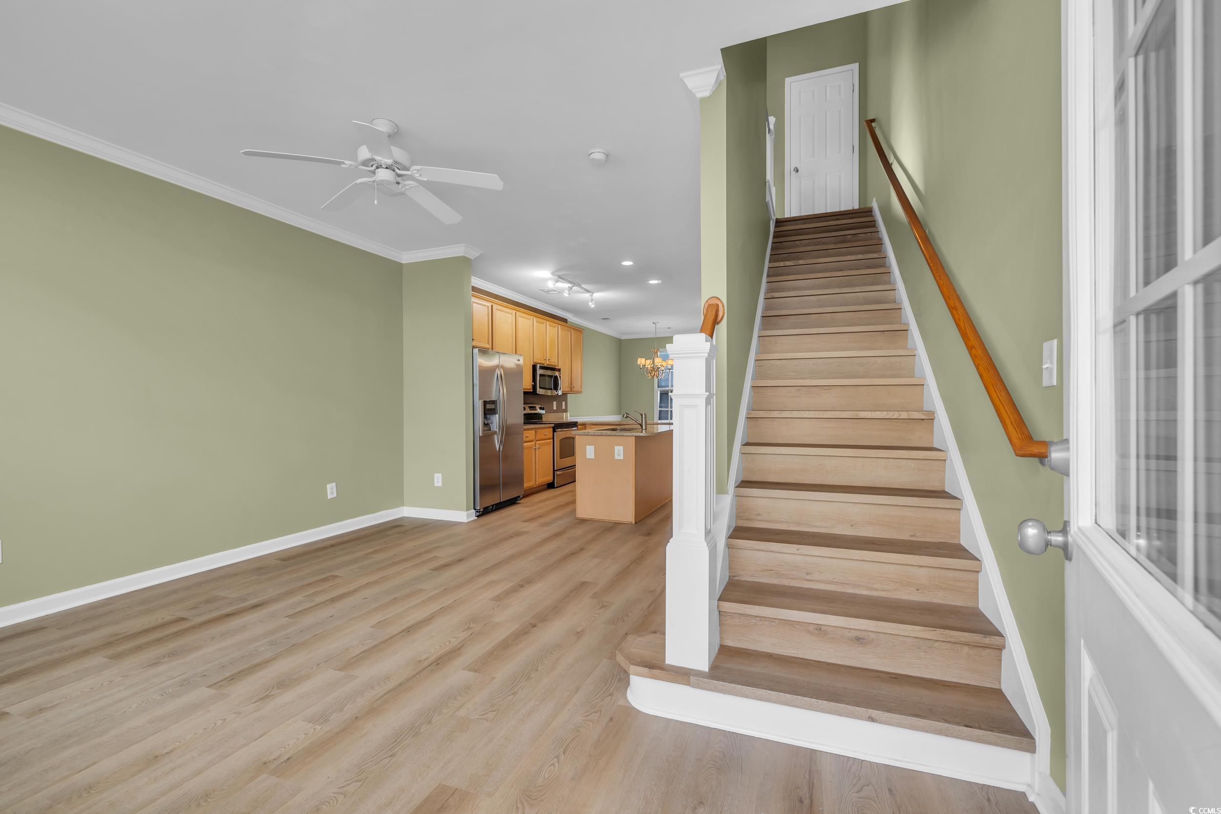 945 Rosencrans Lane, Unit B Myrtle Beach, SC 29577 - Photo 13 of 32 Stairs featuring ornamental molding, wood finished floors, recessed lighting, and a ceiling fan