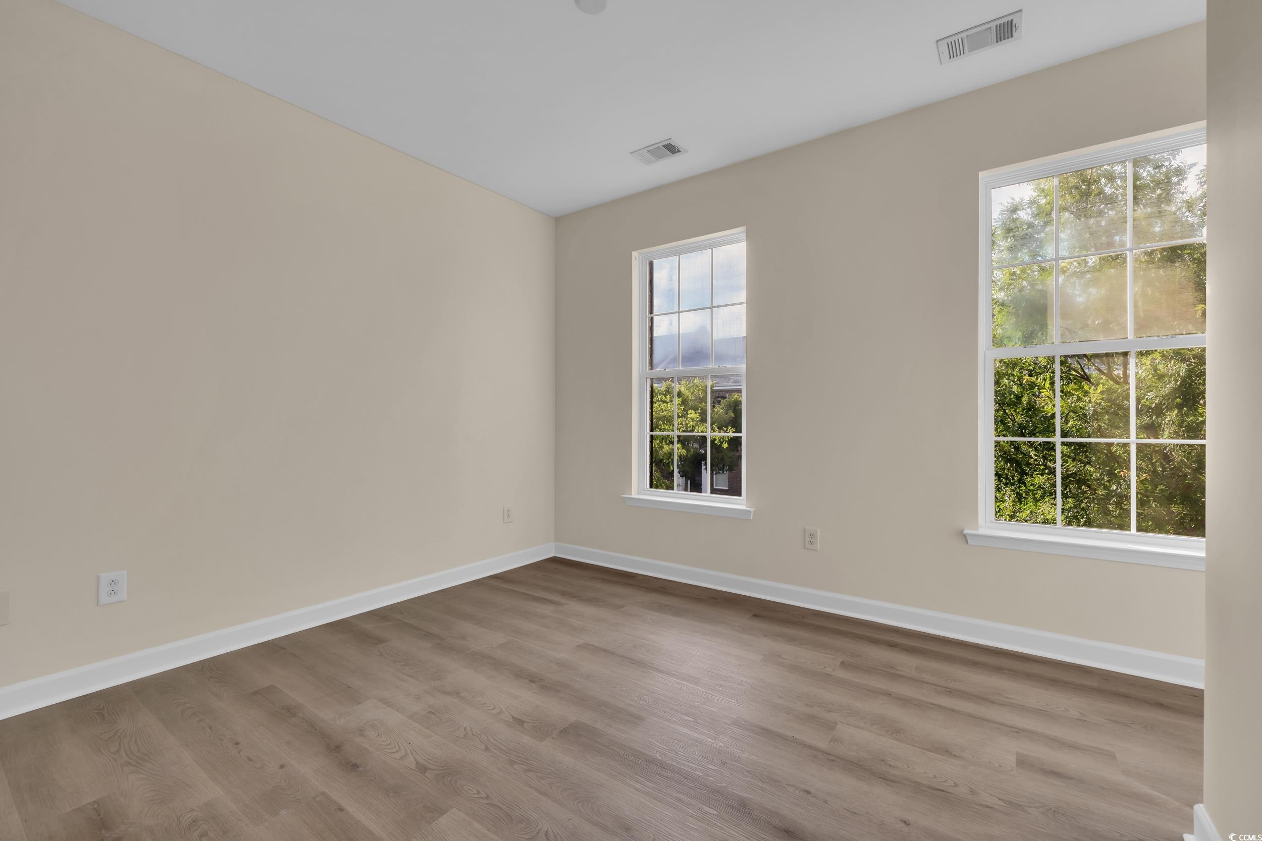 945 Rosencrans Lane, Unit B Myrtle Beach, SC 29577 - Photo 14 of 32 Empty room featuring wood finished floors