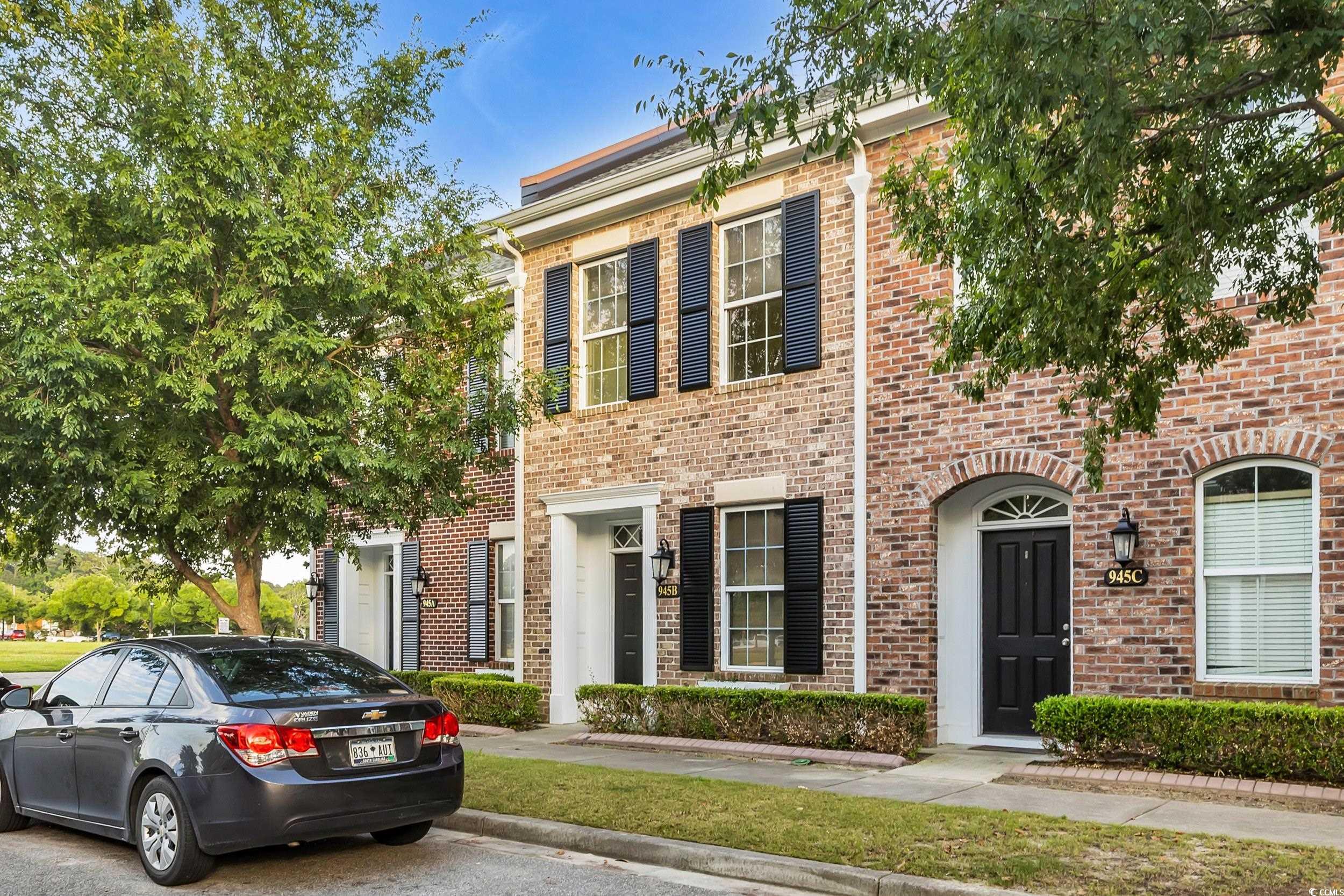 945 Rosencrans Lane, Unit B Myrtle Beach, SC 29577 - Photo 2 of 32 Multi unit property featuring brick siding