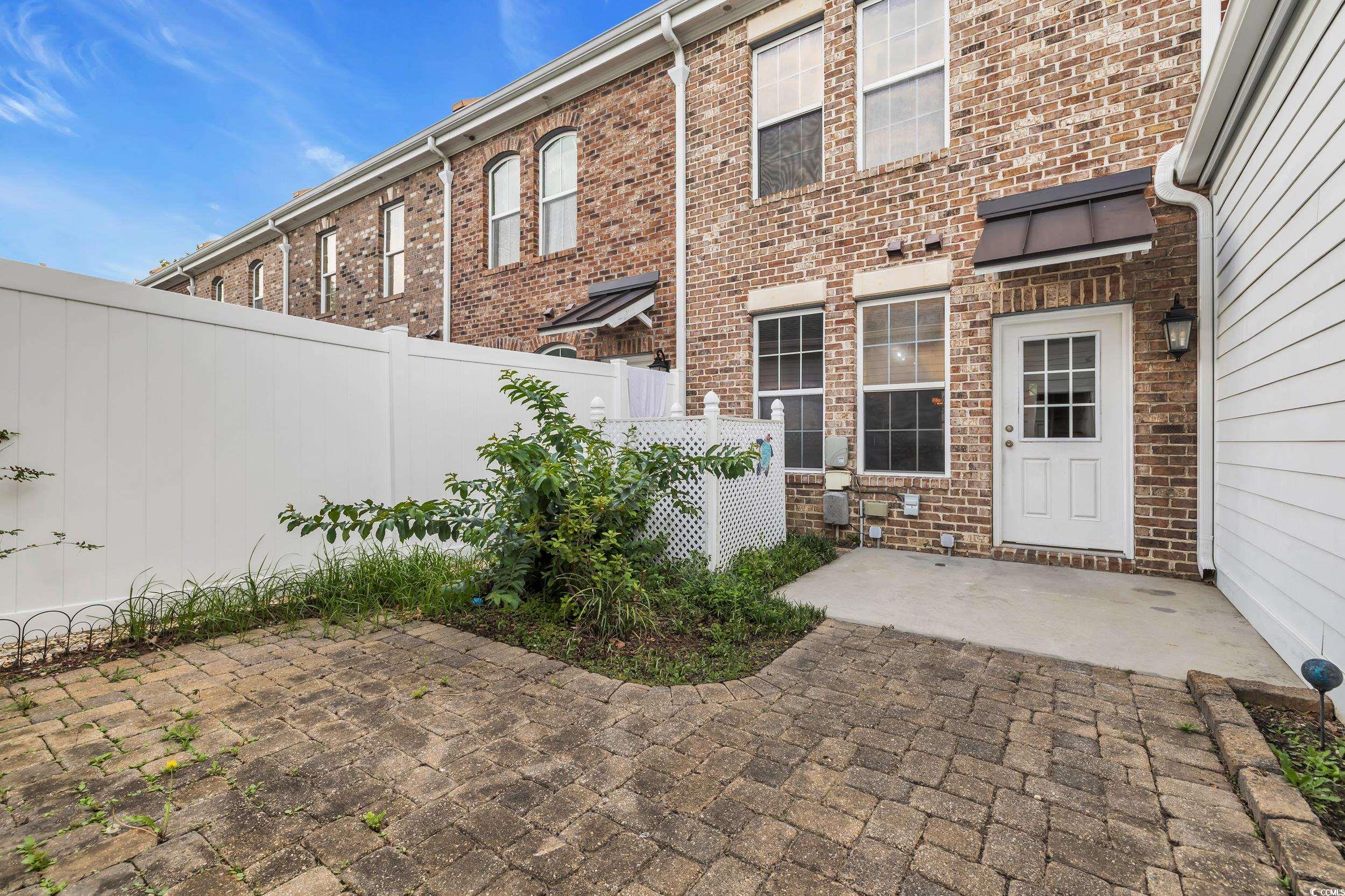 945 Rosencrans Lane, Unit B Myrtle Beach, SC 29577 - Photo 23 of 32 Fenced backyard with a patio