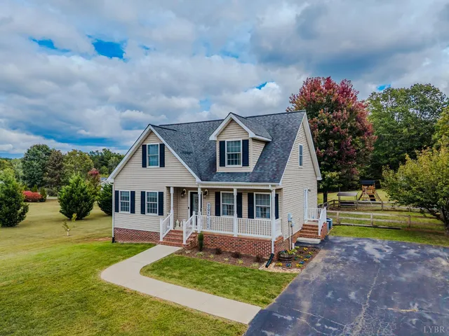 a front view of a house with a yard table and chairs