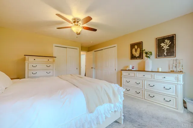 a bedroom with furniture and baby bed