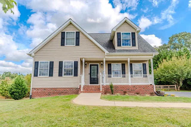 a bedroom with furniture and a potted plant