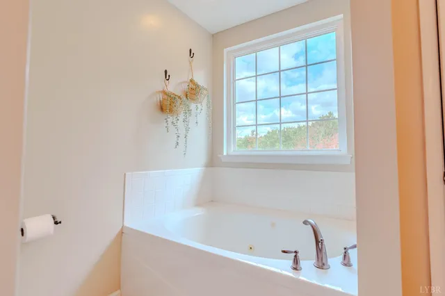 a view of a house with swimming pool and sitting area