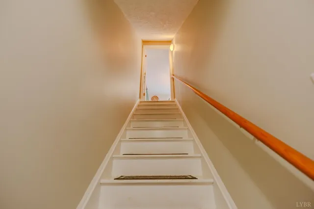 a view of a house with yard and sitting area