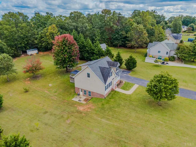 a view of a swimming pool with a yard